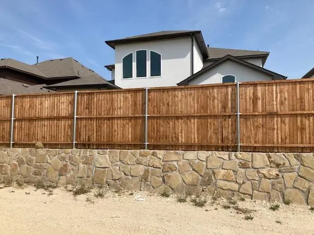 Stone Retaining Wall with Fence