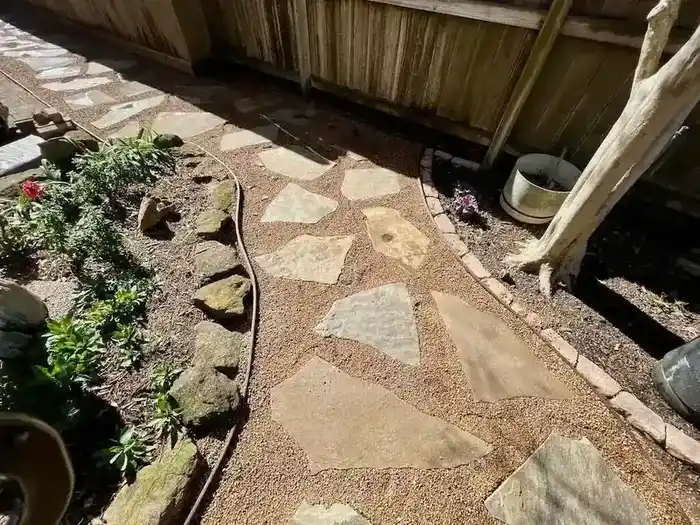 Flagstone patio set in decomposed granite in Parker County